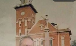 Sheriff Hannan stands for a photo in front of the Bibb County Courthouse in Centreville, AL.