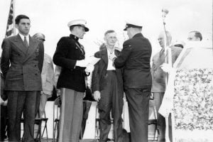 Ross Gray's father receiving his son's award from Rear Admiral A. S. Merrill.