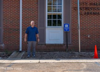 Centreville Mayor Terry Morton stands outside the City Hall window that will become the new drive-thru.