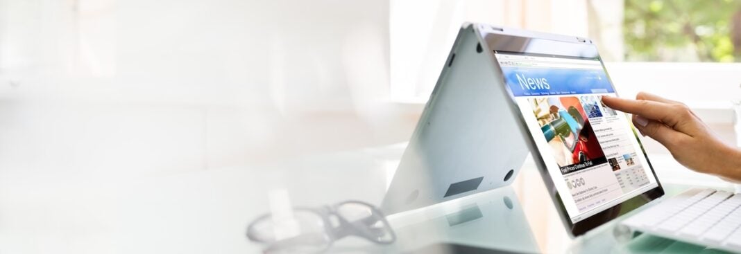 Reading News Website Or Electronic Newspaper